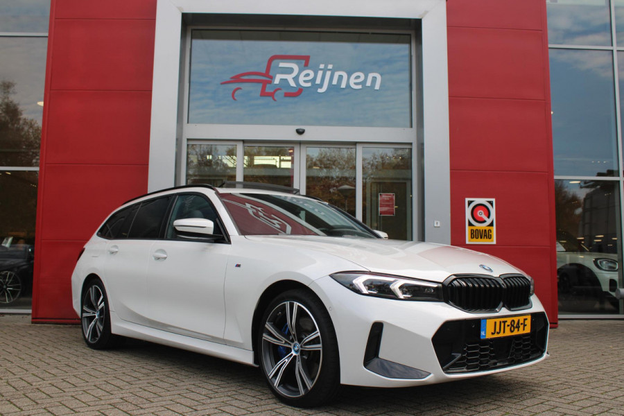 BMW 3 Serie Touring 330e 292PK M-SPORT | PANORAMISCH SCHUIF/KANTEL DAK | M-SPORT PRO-PAKKET | M-SPORT REMMEN UITGEVOERD IN DONKERBLAUW MET M LOGO | BMW LIVE COCKPIT PROFESSIONAL | CURVED DISPLAY |DRIVING ASSISTANT INCL. HEAD-UP DISPLAY | PARKING ASSIST INCL. ACHTERUITRIJCAMERA | ADAPTIEVE LED KOPLAMPEN |SHADOW LINE | M-SPORTSTOELEN VOOR | LEDER VERNASCA MET CONTRAST STIKSELS M-SPORT | STOEL VERWARMING | DRAADLOZE APPLE CARPLAY | ELEKTRISCH VERSTELBARE STOELEN MET GEHEUGEN FUNCTIE | HEAD UP DISPLAY | DRAADLOZE TELEFOONLADER | DODEHOEK BEWAKING | COMFORT PACK INCL. ELEKTRISCHE ACHTE