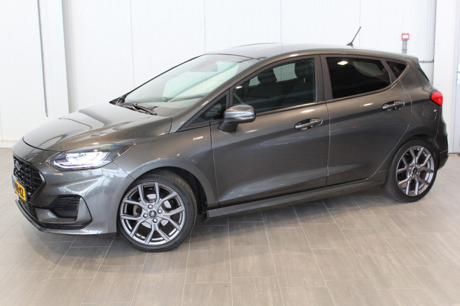 Ford Fiesta 1.0-125pk EcoBoost Mild-Hybrid ST-Line. Luxe, sportieve en goed onderhouden Fiesta ! Autm. airco, Cruise control, Lane assist, 17" Lmv, Parkeersensoren Achter, Metallic lak, Navigatie by Apple/Android, LED verlichting etc.