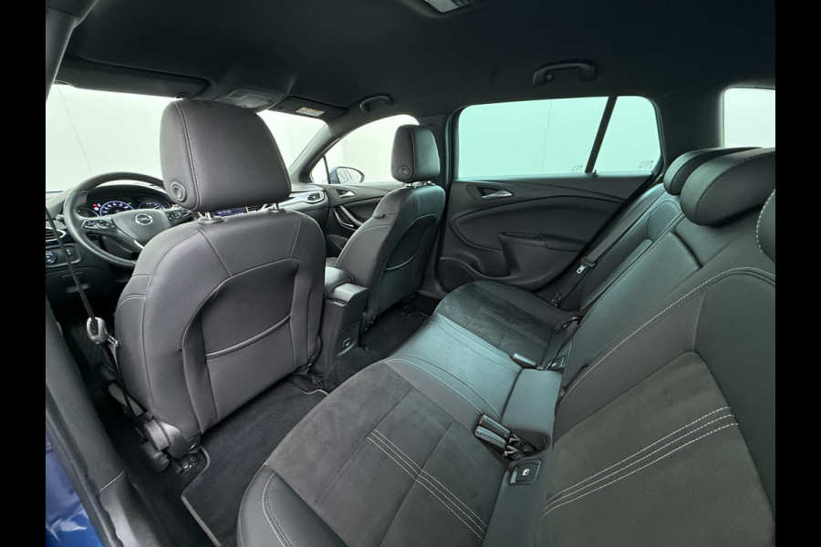 Opel Astra Sports Tourer 1.2T Leer/Alcantara Led-Matrix Innovation Bose®-Hifi Navi Camera Park-Assist + PDC-a+v Apple Carplay Android Keyle AGR-Comfort-Stoel+Stuur+Voorruitverwarming Elek.Achterklep Pdc Lane Assist DAB Regen-Lichtsensor Bordherkenning Zwarte-Hemel Origineel Nederlandse Auto Zeer luxe uitvoering! A-Label EURO6  € 30.000 nieuw