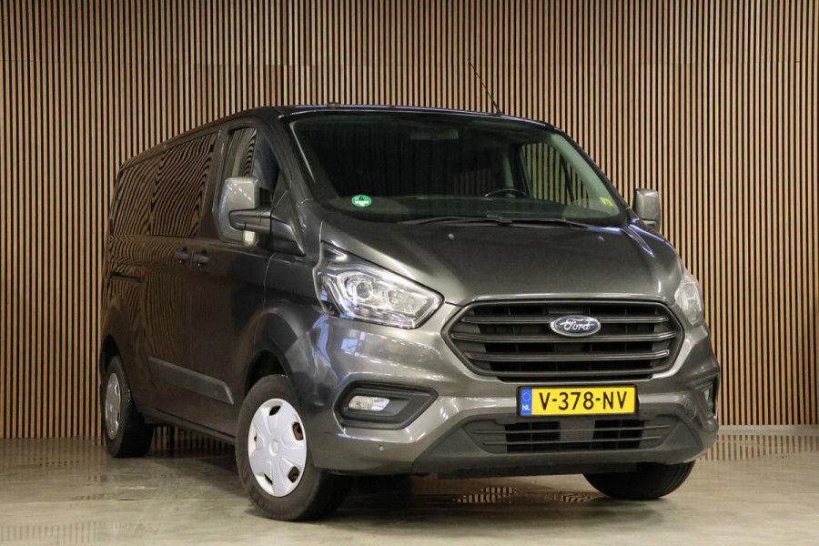 Ford Transit Custom 300 2.0 TDCI L2H1 DC | Dubbel Cabine | 5-Zitter | Stoelverwarming | DAB | PDC V+A | Cruise control | Trekhaak | MF Stuur | Airco | Nieuwe APK | NAP Logisch | Motorrevisie | Nieuwe distributiriem | Euro 6