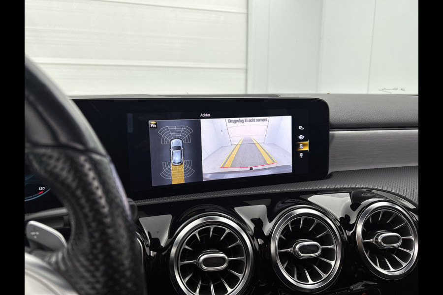 Mercedes-Benz A-Klasse 180 Business Solution AMG AMG Line | Night Pakket | Panorama Schuif-Kanteldak | Sfeerverlichting | Trekhaak | MultiBeam Koplampen | Achteruitrijcamera. Inclusief 24 maanden Mercedes-Benz Certified garantie voor Europa.