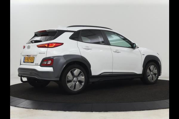 Hyundai Kona EV Limited 64 kWh | Schuifdak | Leder | Trekhaak | Stoelventilatie | Head-Up | Carplay | Warmtepomp | Achterbankverwarming | Navigatie | Camera | Full LED | Keyless