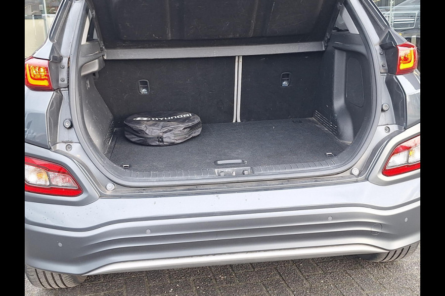 Hyundai Kona EV Premium 64 kWh | SOH: 94,6% | Leder | Warmtepomp | Adaptive CC | Navi | Camera |