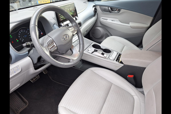 Hyundai Kona EV Premium 64 kWh | SOH: 94,6% | Leder | Warmtepomp | Adaptive CC | Navi | Camera |