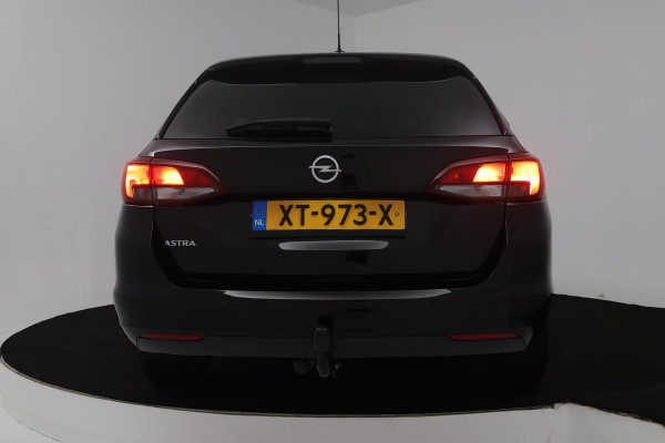 Opel Astra Sports Tourer 1.4 Turbo 120 Jaar Edition (TREKHAAK, PARKEERSENSOREN, CRUISE CONTROL, NAVIGATIE)