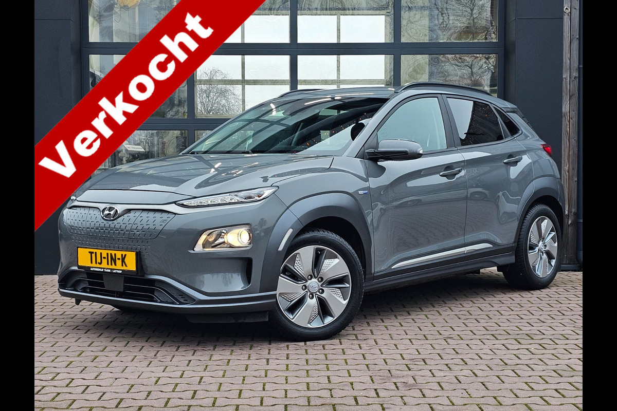 Hyundai Kona EV Comfort 39 kWh | SOH 98% | Stoelverwarming | Krell | Navi |  All-seasons | Camera | Stuurverwarming | Rijklaar |