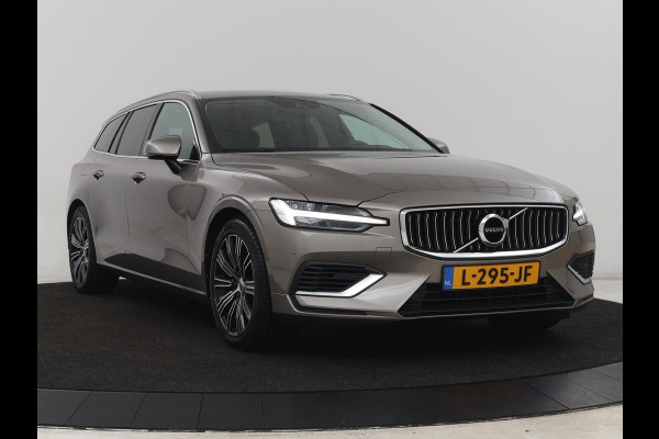 Volvo V60 2.0 T6 AWD Recharge Business Pro | Leder | Trekhaak | Stoel & stuurverwarming | Adaptive cruise | Camera | Carplay | Navigatie | Full LED | Parkeerhulp | PHEV | Plug In