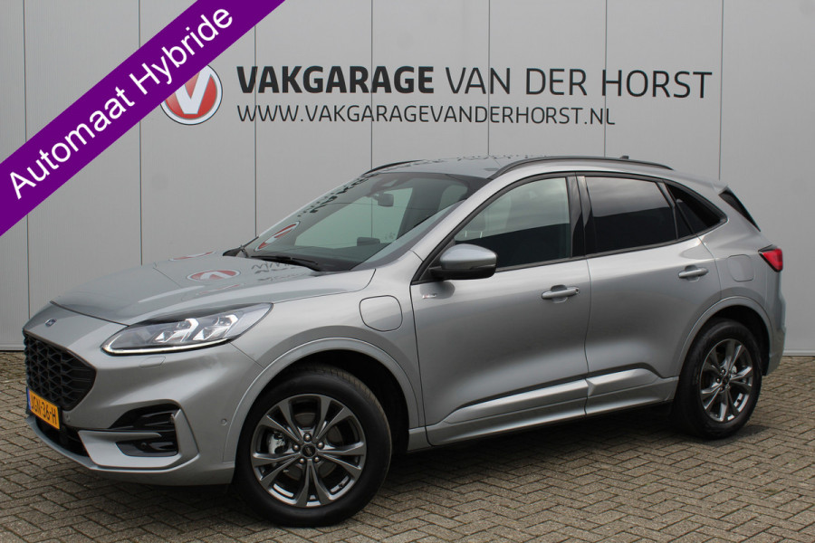 Ford Kuga 2.5-225 PK PHEV ST-Line X. Hybride rijden voor een reële prijs ! Autm. airco, Stoel- en voorraamverw., Side- en lane assist, Adaptieve cruise cntrl, elektr. achterklep, Keyless entry/keyless go, Trekhaak afneemb., Navigatie, Telefoonvoorb. etc