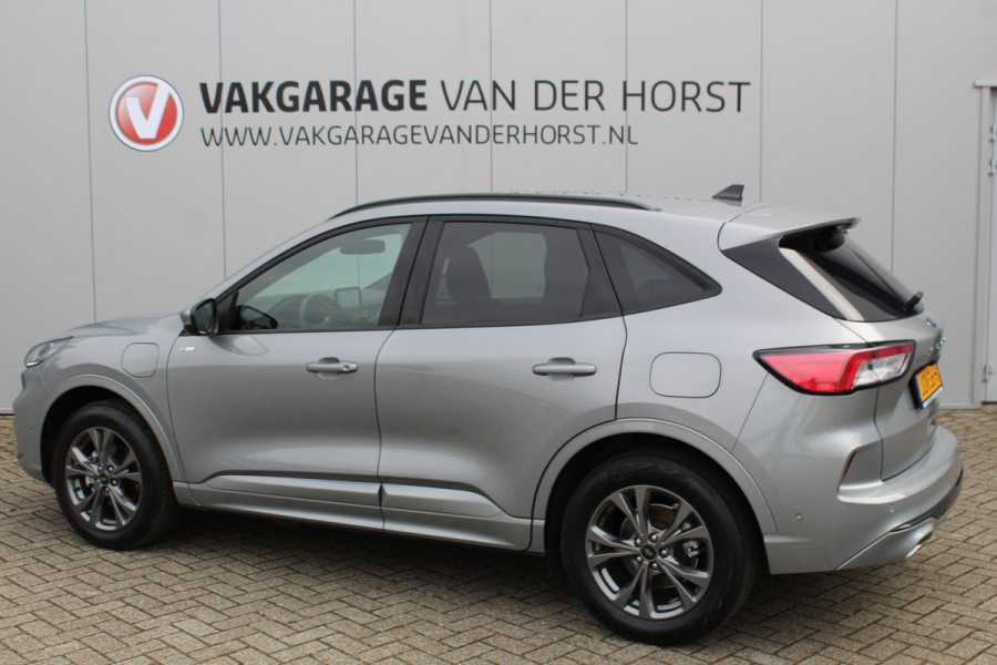 Ford Kuga 2.5-225 PK PHEV ST-Line X. Hybride rijden voor een reële prijs ! Autm. airco, Stoel- en voorraamverw., Side- en lane assist, Adaptieve cruise cntrl, elektr. achterklep, Keyless entry/keyless go, Trekhaak afneemb., Navigatie, Telefoonvoorb. etc