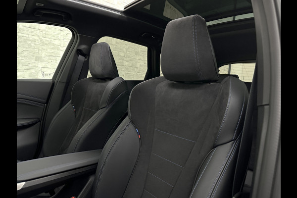 BMW X1 18i M-Sport Performance-Pack | Panorama | Sportstoelen | Carbon | Keyless-Entry | Sfeerverlichting | Achteruitrij-Camera | Carplay | Full-LED | Black-Optic | Getint Glas | Stoelverwarming | Draadloos Laden |