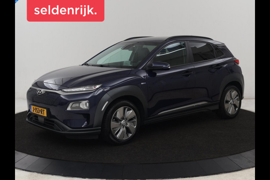 Hyundai Kona EV Premium 64 kWh | Leder | Stoelventilatie | Adaptive cruise | Wamtepomp | Head-Up | Camera | Carplay | Achterbankverwarming | Navigatie | Keyless