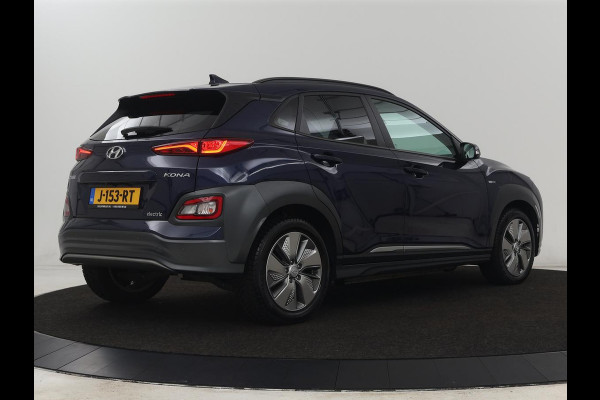 Hyundai Kona EV Premium 64 kWh | Leder | Stoelventilatie | Adaptive cruise | Wamtepomp | Head-Up | Camera | Carplay | Achterbankverwarming | Navigatie | Keyless