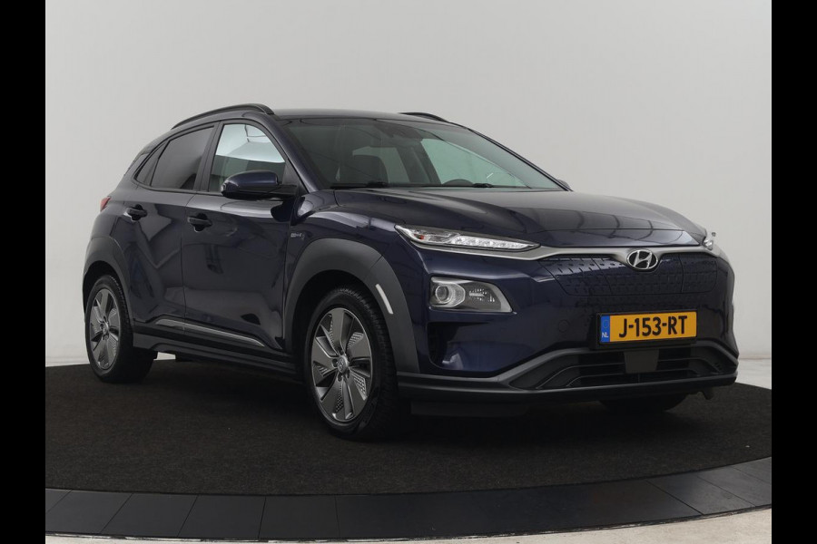 Hyundai Kona EV Premium 64 kWh | Leder | Stoelventilatie | Adaptive cruise | Wamtepomp | Head-Up | Camera | Carplay | Achterbankverwarming | Navigatie | Keyless