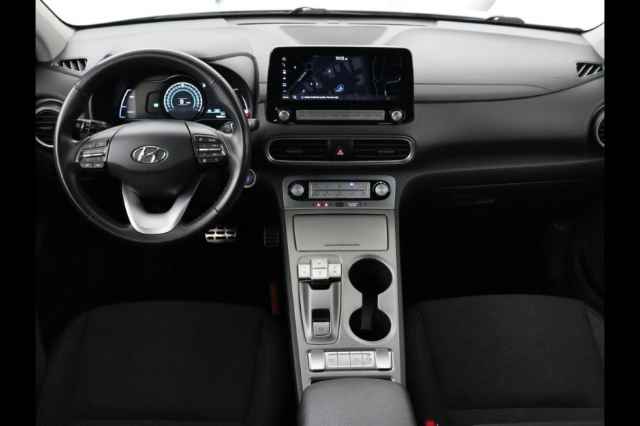 Hyundai Kona EV Comfort 64 kWh | Trekhaak | Adaptive cruise | Warmtepomp | Camera | Carplay | Keyless | Navigatie | Climate control