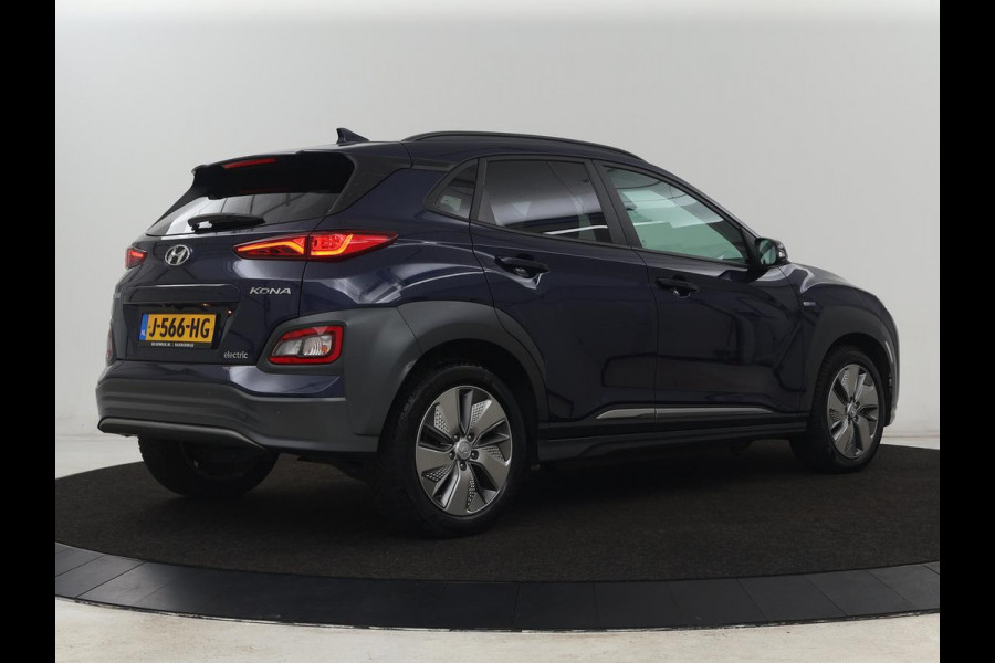 Hyundai Kona EV Fashion 64 kWh | 3-Fase | SOH 100% | Head-Up | Adaptive cruise | Carplay | Warmtepomp | Camera | Krell Audio | Navigatie | Parkeerhulp