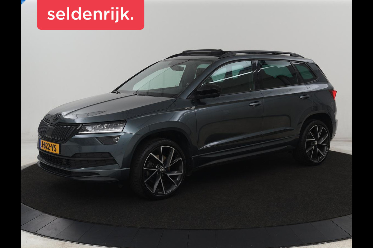 Škoda Karoq 1.5 TSI Sportline | Panoramadak | Trekhaak | Stoelverwarming | Camera | Carplay | Virtual Cockpit | Canton Sound | 19'' | Parkeerhulp | Navigatie | Sfeerverlichting | Cruise control | Stuurverwarming