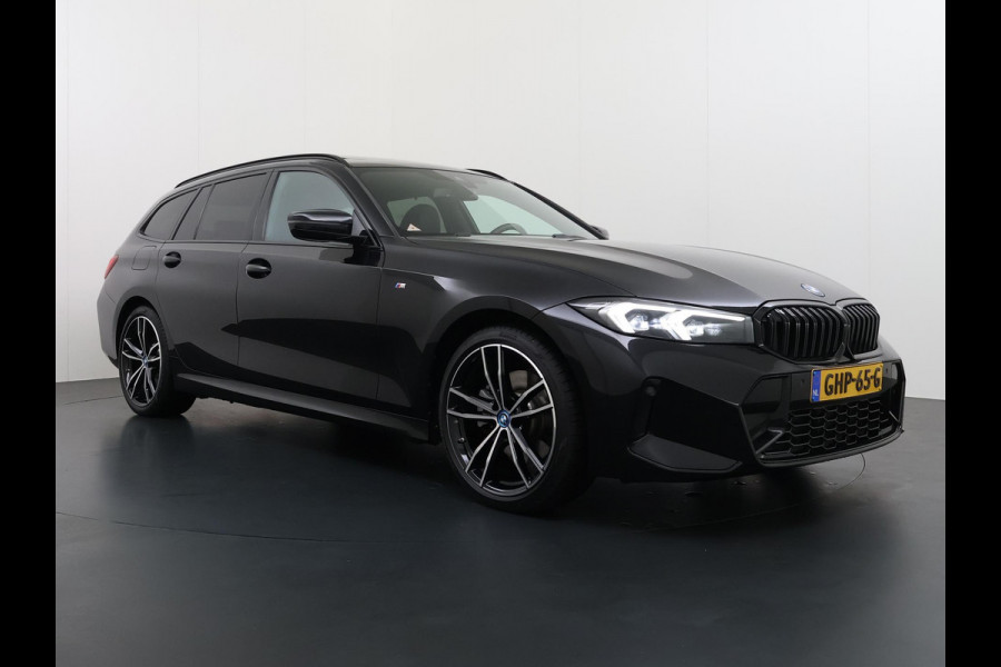 BMW 3 Serie Touring 320e VAN € 42.899,- VOOR € 39.877,- UW LENTEVOORDEEL: €3.022,-! | M-SPORT | FACELIFT| PANO|1.STE EIGENAAR, DEALER OH. | LEER | ELEK. TREKHAAK| FABRIEKSGARANTIE T/M 08 2027| LEER| STOELVERWARMING| 19 INCH! SUPER COMPLEET!