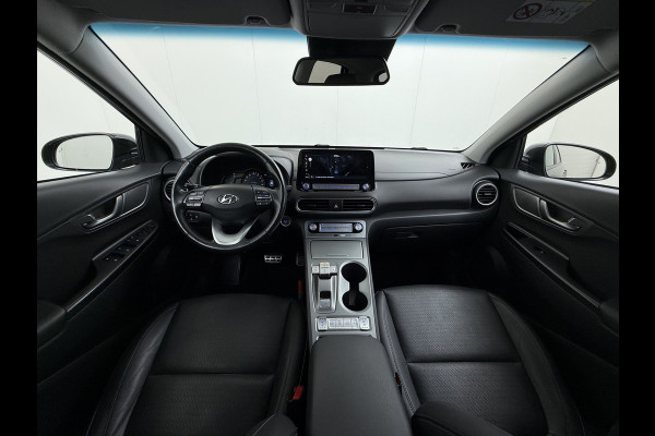 Hyundai Kona EV 64kWh 204pk SOH 100% Premium Leer Warmtepomp Head-Up Display Apple Carplay Android Navi Camera Elektr.Stoelen+Leer+Verwarmd+G Pdc Subwoofer Bluetooth Dodehoek detector Privacy Glas Rijstrooksensor 1e Eigenaar Origineel Nederlandse Auto