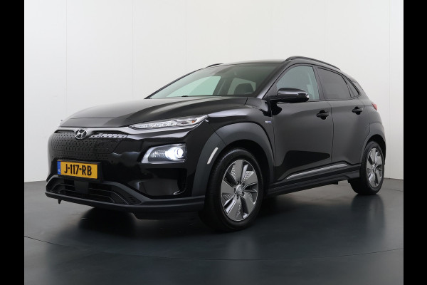 Hyundai Kona EV 64kWh 204pk SOH 100% Premium Leer Warmtepomp Head-Up Display Apple Carplay Android Navi Camera Elektr.Stoelen+Leer+Verwarmd+G Pdc Subwoofer Bluetooth Dodehoek detector Privacy Glas Rijstrooksensor 1e Eigenaar Origineel Nederlandse Auto