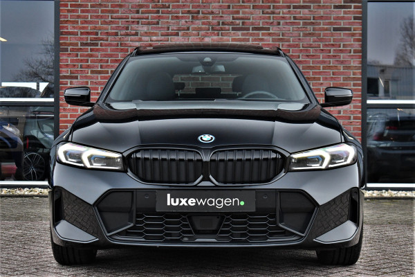 BMW 3 Serie Touring 330e M-Sport Pano ACC Trekh H/K HUD 19inch Stuurverw