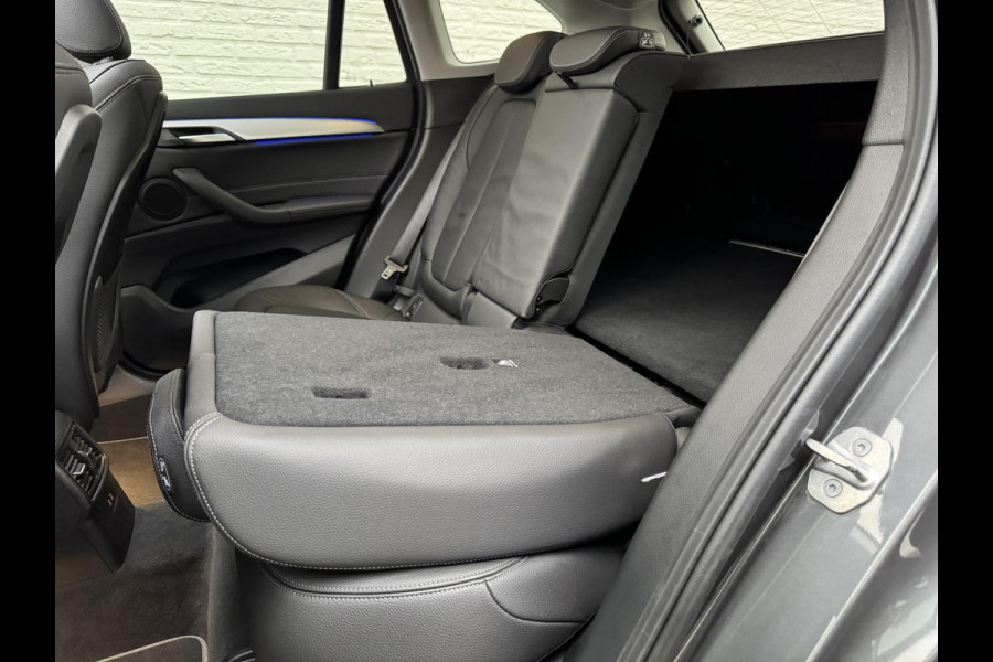 BMW X1 SDrive18i High Executive Cruise Climate control Leer+memory Sfeerverlichting Navigatie Full LED Parkeersensoren