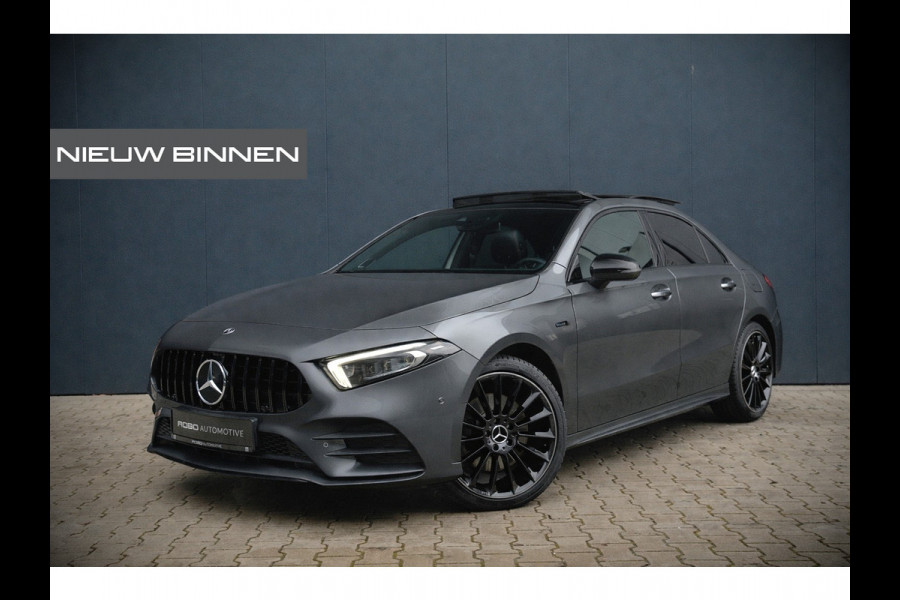 Mercedes-Benz A-Klasse 180 Business Solution AMG | Panoramadak | Memory Seats | Ambiance Verlichting | Stoelverwarming | Camera | Navigatie | Apple Carplay | Keyless | Dodehoekdetectie | Cruise Control | DAB |