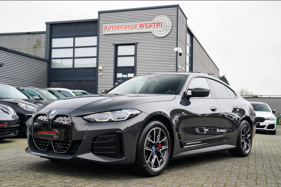 BMW i4 M50 High Executive 84 kWh | BTW | 360 Camera | LASER | Dravitgrau metallic | Adaptieve Cruise | Trekhaak | Schuif/kanteldak