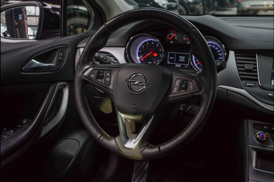 Opel Astra Sports Tourer 1.4 Navi Stoel- & stuurverw. Airco Carplay PDC Cruise LM velgen BTW auto
