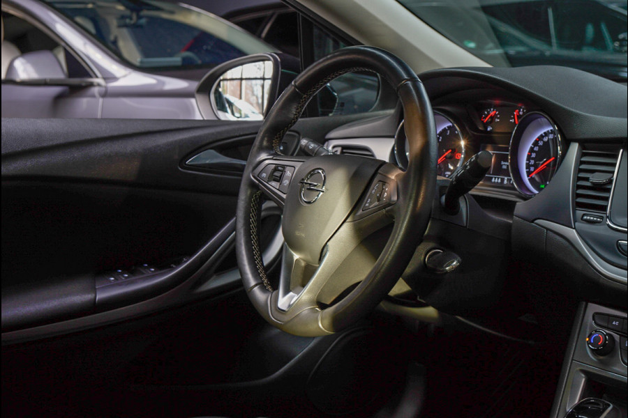 Opel Astra Sports Tourer 1.4 Navi Stoel- & stuurverw. Airco Carplay PDC Cruise LM velgen BTW auto