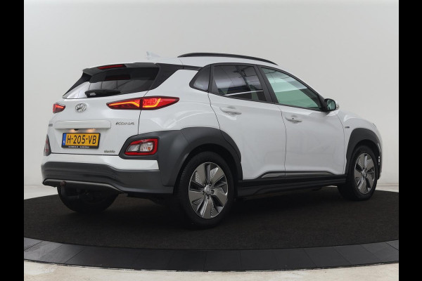 Hyundai Kona EV Premium 64 kWh | SOH 100% | 3 Fase | Stoelventilatie | Leder | Head-Up | Warmtepomp | Trekhaak | Achterbankverwarming | Adaptive cruise | Camera | Carplay | Full LED