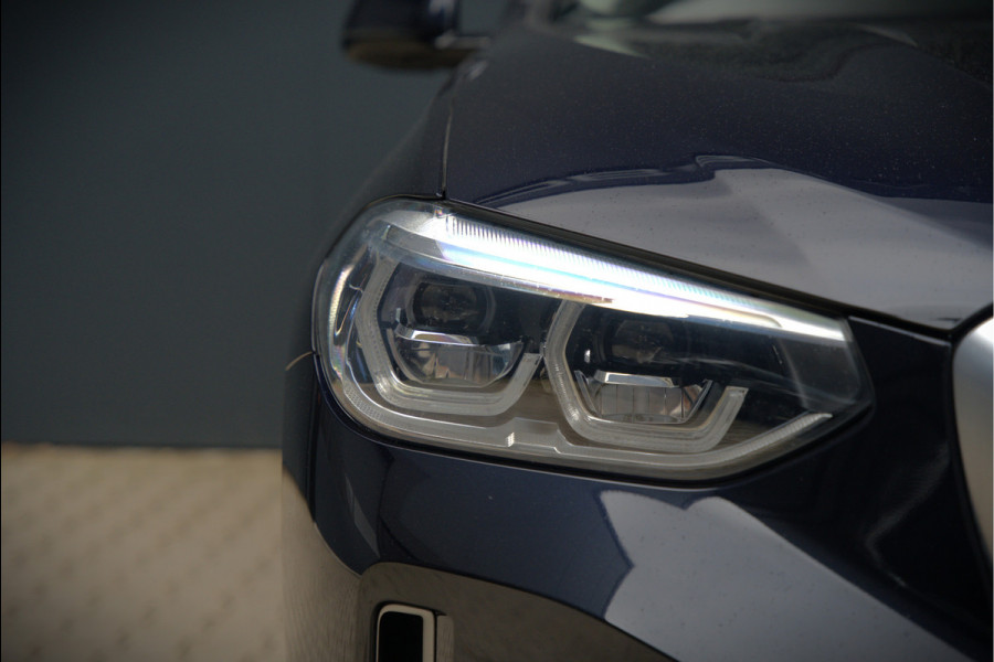 BMW iX3 High Executive 80 kWh | Panoramadak | Keyless | Stoelverwarming | Harman Kardon | Memory Seat | Head-Up Display | 360 Camera | Adaptief Onderstel | Trekhaak | Adaptive LED | Elektrische Stoelen | Apple Carplay |