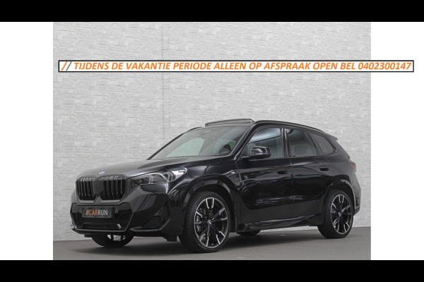 BMW X1 18i M-Sport | Panorama | Sportstoelen | Keyless-Entry | Sfeerverlichting | Achteruitrij-Camera | 5x op voorraad | Carplay | Full-LED | Black-Optic | Getint Glas | Stoelverwarming | Draadloos Laden |