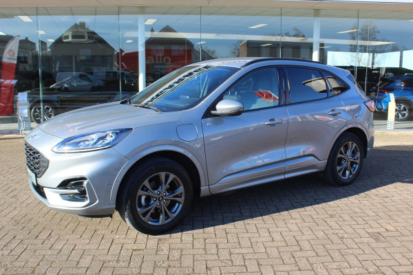 Ford Kuga 2.5-225 PK PHEV ST-Line X. 1500kg Trekgewicht Hybride rijden voor een reële prijs ! Autm. airco, Stoel- en voorraamverw., Side- en lane assist, Adaptieve cruise cntrl, elektr. achterklep, Keyless entry/keyless go, Trekhaak , Navigatie, Telefoonvoorb. etc