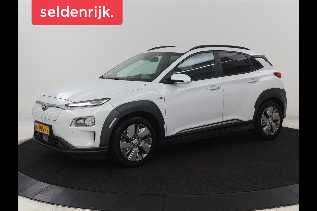Hyundai Kona EV Premium 64 kWh | SOH 100% | 3 Fase | Stoelventilatie | Leder | Head-Up | Warmtepomp | Trekhaak | Achterbankverwarming | Adaptive cruise | Camera | Carplay | Full LED