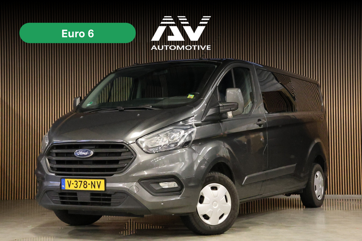 Ford Transit Custom 300 2.0 TDCI L2H1 DC | Dubbel Cabine | 5-Zitter | Stoelverwarming | DAB | PDC V+A | Cruise control | Trekhaak | MF Stuur | Airco | Nieuwe APK | NAP Logisch | Motorrevisie | Nieuwe distributiriem | Euro 6