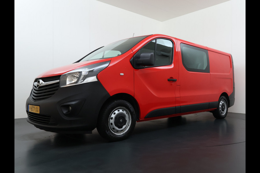 Opel Vivaro D126PK Dubbele Cabine 5-Persoons L2H1 Trekhaak Camera Navi Airco Cruise Control Pdc Sport EcoFlex 1.6CDTI Euro 6 Betonplex Vloer Wandbetimmering Schuifdeur Regen-Lichtsensor 1e Eigenaar Origineel Nederlandse Auto Dealeronderhouden 2.000kg trekvermogen
