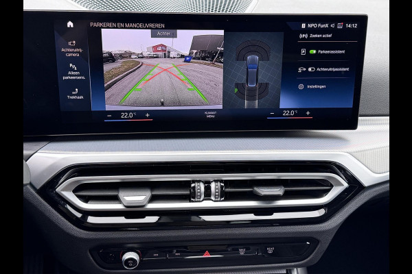 BMW 3 Serie Touring 320e | Trekhaak | Nieuw model | Carplay | Camera | Skyscraper grau | Sfeerverlichting | Widescreen | M Shadow