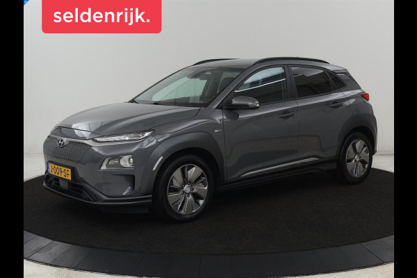 Hyundai Kona EV Premium 64 kWh | SOH 100% | 3 Fase | Stoelventilatie | Leder | Head-Up | Warmtepomp | Camera | Achterbankverwarming | Carplay | Navigatie | Adaptive cruise | Keyless | Parkeerhulp