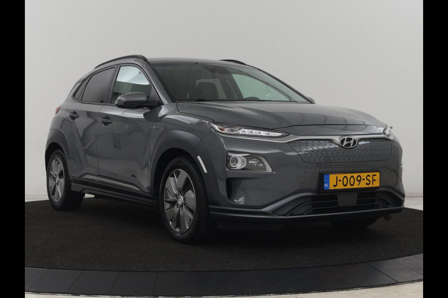 Hyundai Kona EV Premium 64 kWh | SOH 100% | 3 Fase | Stoelventilatie | Leder | Head-Up | Warmtepomp | Camera | Achterbankverwarming | Carplay | Navigatie | Adaptive cruise | Keyless | Parkeerhulp