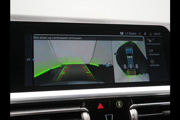 BMW 3 Serie Touring 330e Sportline Plug In Hybrid 293pk Dealer O.H PHEV | Panodak | Trekhaak af Fabriek | Lederen Sportstoelen Memory | 360 Camera | Keyless | Camera & Parkassist | 18"L.M | Apple Carplay | Sfeerverlichting |