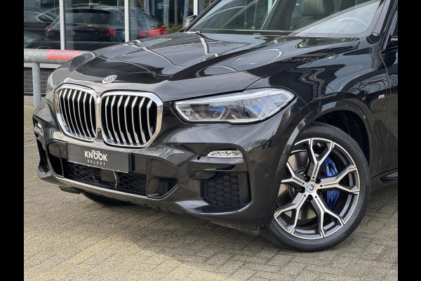 BMW X5 xDrive45e High Executive M Sport Pakket Automaat / Panoramadak / Active Steering / Trekhaak / Head-Up Display / Comfortstoelen / Laserlight / Driving Assistant Professional / 21 Inch / Luchtvering / Hifi / Craftedclarity / Shadow Line / M Sportremsysteem