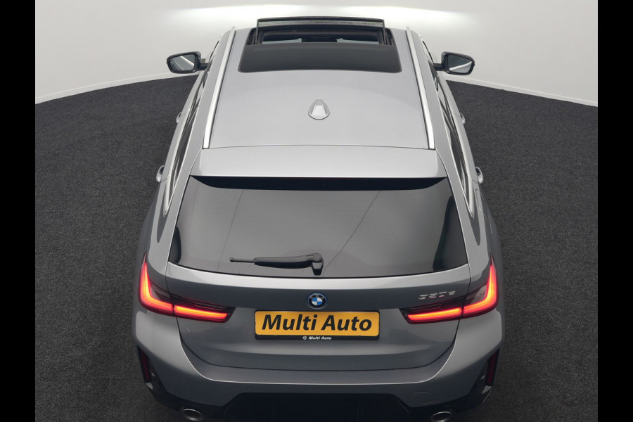BMW 3 Serie Touring 320e M Sport FACELIFT MODEL Plug In Hybrid Dealer O.H PHEV | Panodak | Trekhaak af Fabriek | Adaptive Cruise |  Alcantara Sportstoelen Memory | Widescreen Navi | Keyless | Sfeerverlichting | Apple Carplay | 18"L.M |
