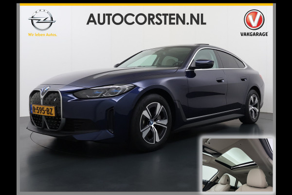 BMW i4 eDrive40 340pk 84kWh Pano-Dak/Hefdak Leer SportSt+Leer+(Stuur+)Verwarmd 360°Camera SOH 99% Adaptive-Cruise+s&go High Executive P Semi-Autopilot Drive-Assist-pro Active-Guard-Plus Elektr.Achterklep Draadl-Lader BAS ESP BMW Individual interieurlijsten Pianolak schwarz BMW Individual Exterieur Line Aluminium satiniert BMW Copilot-pack Dodehoekdetectie/correctie, Kruisend-verkeer-Detectie, rijstrooksensor met correctie, rondomzicht camera, uitwijk assistent) 0-100 5,6 sec. 1600kg trekvermogen! € 73.000 nieuw