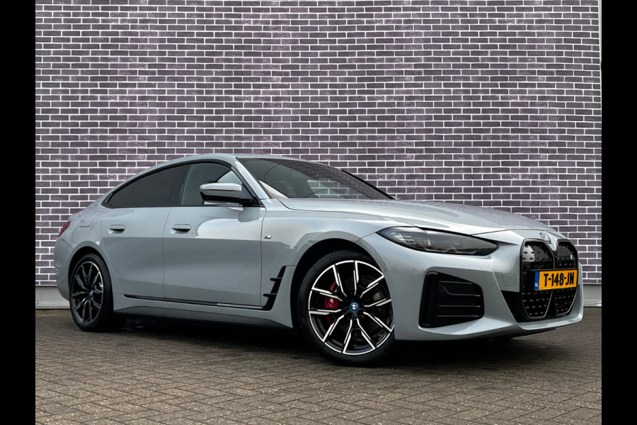 BMW i4 eDrive40 High Executive 84 kWh / Trekhaak / 360Camera / Head-up / Leder / 19'' / Navigatie / Stoelverwarming / DAB / Cruise Control