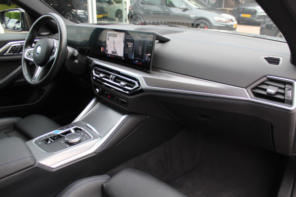 BMW i4 eDrive40 High Executive 84 kWh / Trekhaak / 360Camera / Head-up / Leder / 19'' / Navigatie / Stoelverwarming / DAB / Cruise Control
