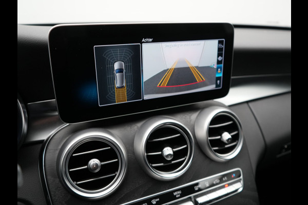 Mercedes-Benz C-Klasse Estate 300 e Business Solution AMG PHEV 320pk | Trekhaak af Fabriek | Adaptive Cruise | Alcantara Sportstoelen Verwarmd | Apple Carplay | Camera | BLIS | 18"L.M | Plug In Hybrid