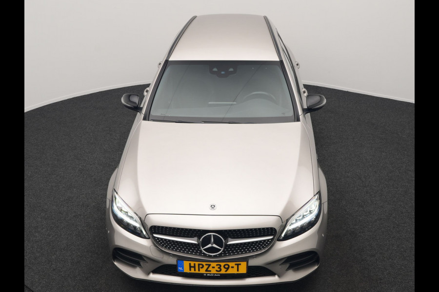Mercedes-Benz C-Klasse Estate 300 e Business Solution AMG PHEV 320pk | Trekhaak af Fabriek | Adaptive Cruise | Alcantara Sportstoelen Verwarmd | Apple Carplay | Camera | BLIS | 18"L.M | Plug In Hybrid