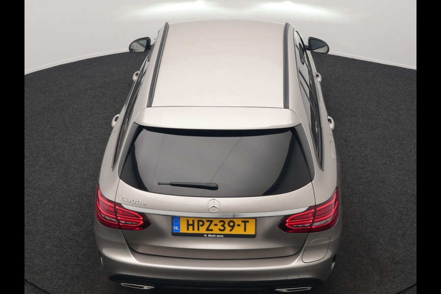 Mercedes-Benz C-Klasse Estate 300 e Business Solution AMG PHEV 320pk | Trekhaak af Fabriek | Adaptive Cruise | Alcantara Sportstoelen Verwarmd | Apple Carplay | Camera | BLIS | 18"L.M | Plug In Hybrid
