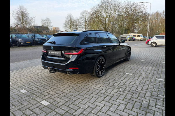 BMW 3 Serie Touring 320e FACELIFT / Navi / Cruise / Camera / Climate / Trekhaak / 20" Breedset.