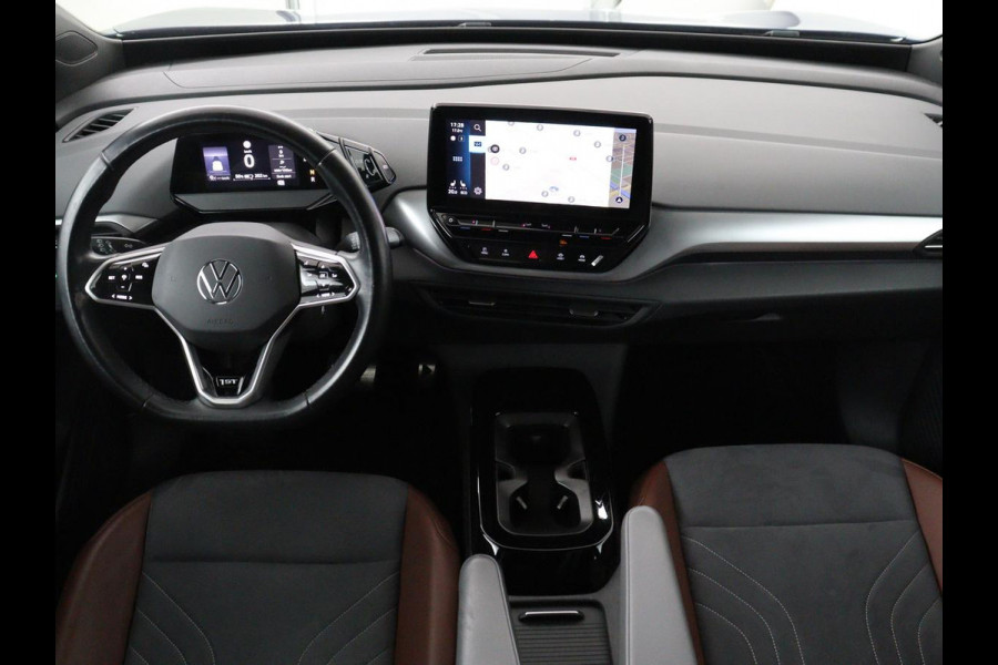 Volkswagen ID.4 First 77 kWh | SOH 90% | Stoel & stuurverwarming | Adaptive cruise | Camera | Carplay | Half leder | Navigatie | 20'' | Full LED | Keyless | Climate control | Sfeerverlichting